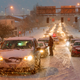 A line of cars, stuck in the snow